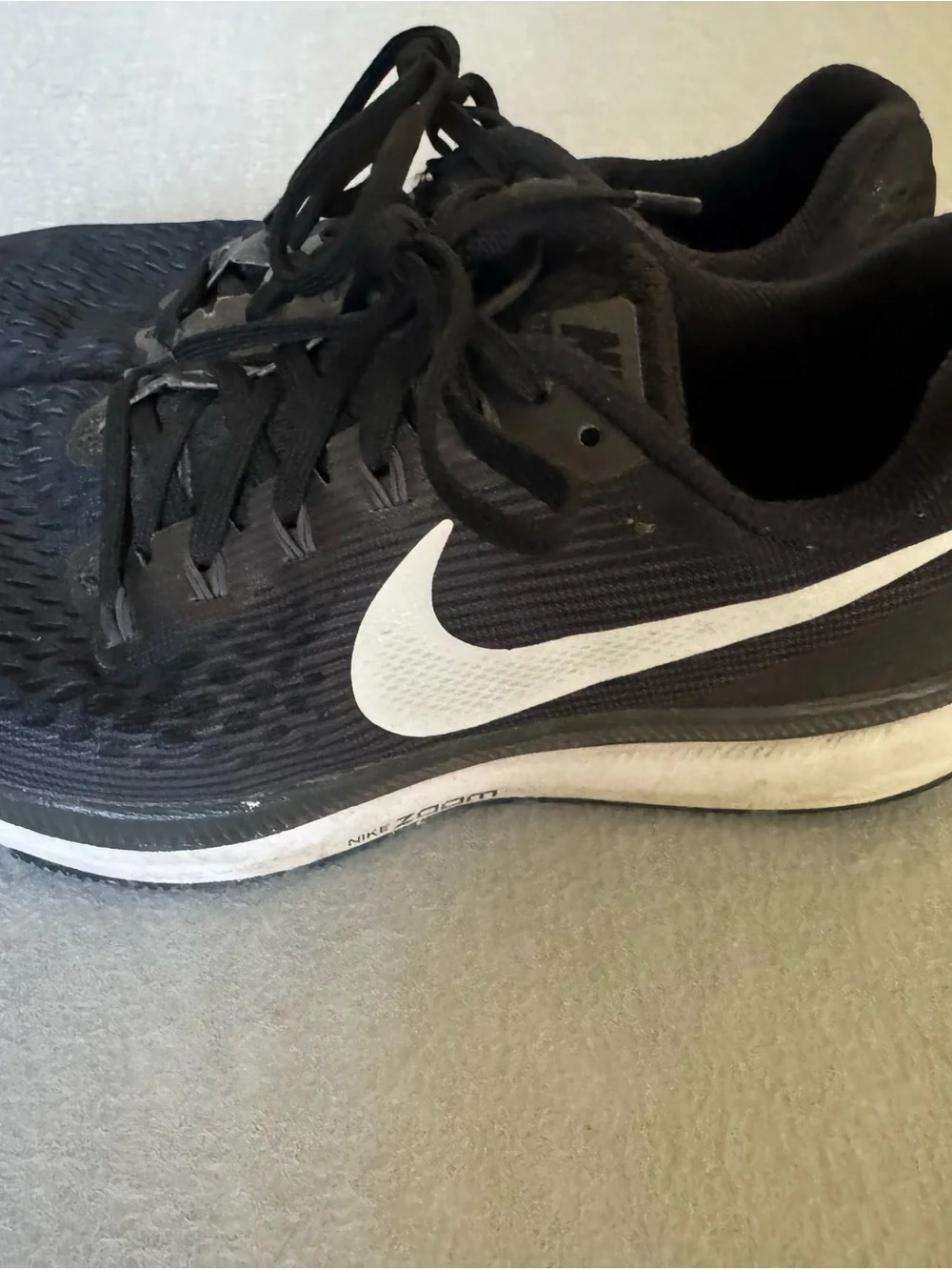Nike Black Athletic Running Shoes with White Swoosh